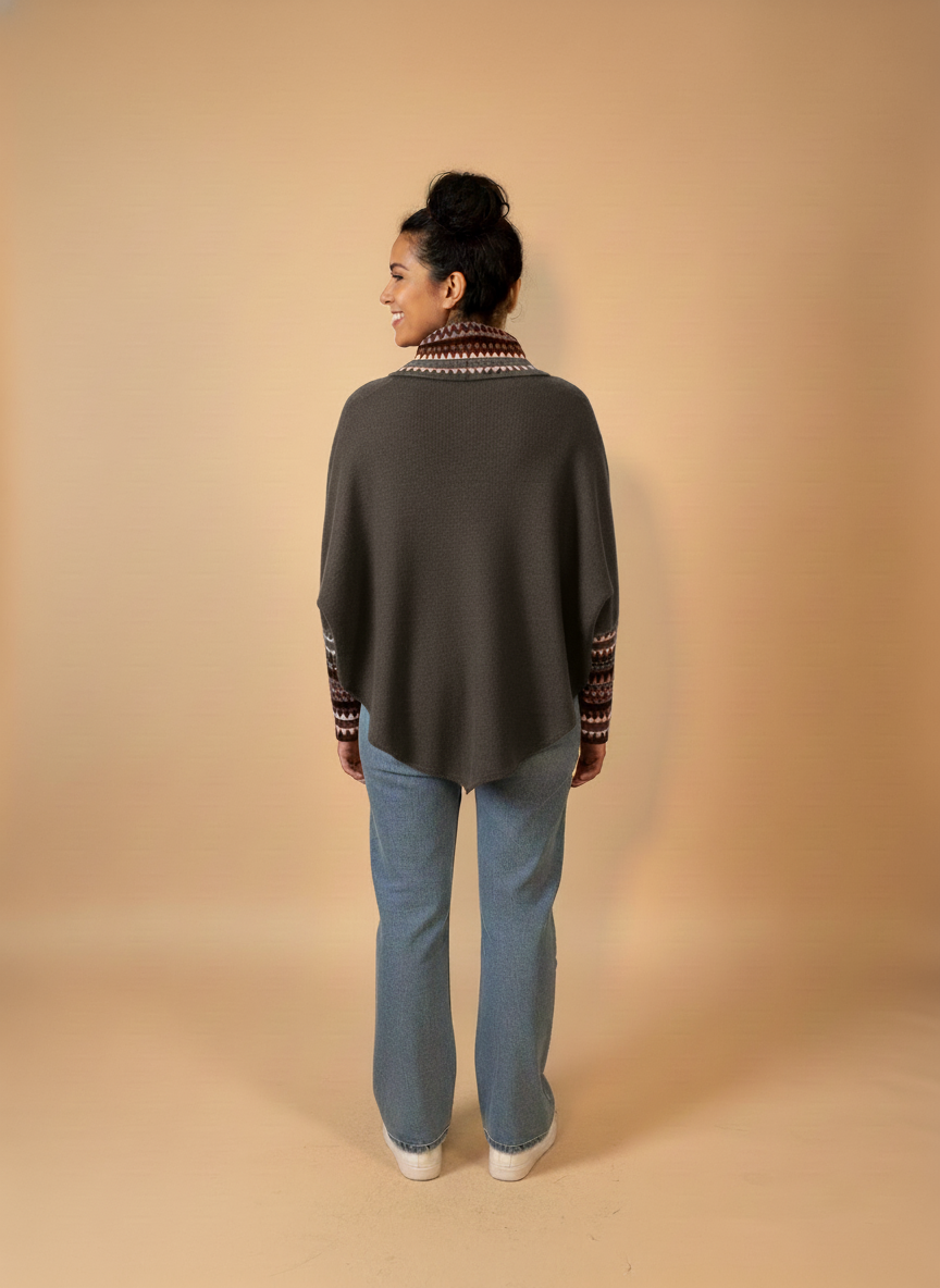 Back view with grey-brown poncho